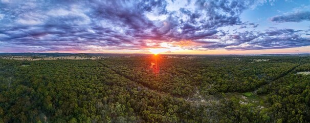 Aerial view of a stunning sunset over the bushland of New South Wales, Australia