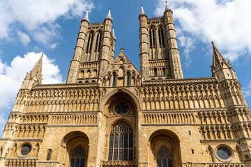 Fototapeta na wymiar Lincoln Cathedral - a highly detailed view, looking up at magnificent Grade I listed architecture