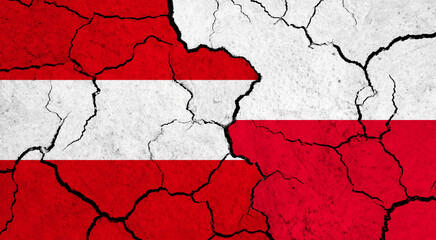 Flags of Austria and Poland on cracked surface - politics, relationship concept