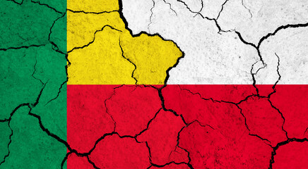Flags of Benin and Poland on cracked surface - politics, relationship concept