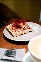 Belgian waffles with cheesecake and berries. Breakfast in cafe