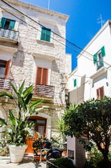 Fototapeta na wymiar Old street with colourful windows in Bari, Italy