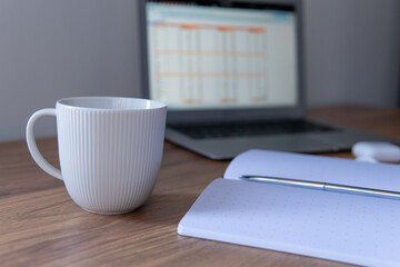 cup of coffee and laptop close up