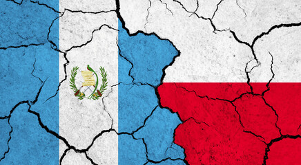 Flags of Guatemala and Poland on cracked surface - politics, relationship concept