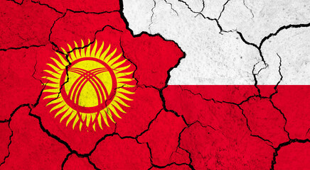 Flags of Kyrgyzstan and Poland on cracked surface - politics, relationship concept
