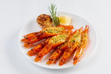 Grilled garlic butter prawns on white background