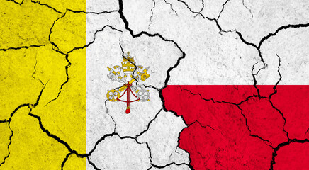 Flags of Vatican City and Poland on cracked surface - politics, relationship concept