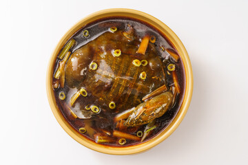Braised soft-shelled turtle with scallions on pure white background