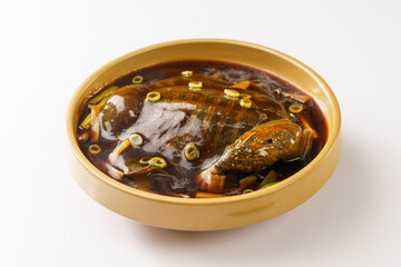 Braised soft-shelled turtle with scallions on pure white background