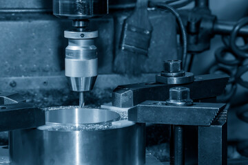 The drilling process on NC milling machine with brass material.