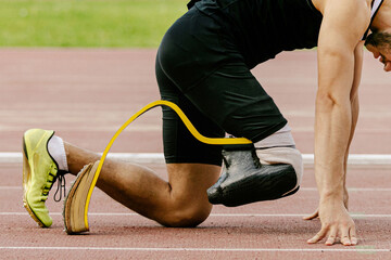 athlete disability runner starting position in running sprint race, sports summer games