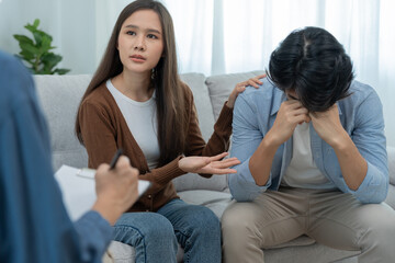 Couple support each while discussing family issues with psychiatrist. wife encourages and empathy husband suffers depression. psychological, divorce, trust, care, workplace and health issues.