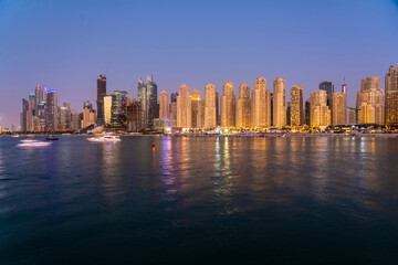 Fototapeta na wymiar Cityscape of Marina Dubai with Marina Beach at night, UAE