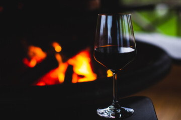 Obraz na płótnie Canvas Wine glass with fire background