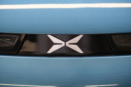 Shanghai,China-August 2nd 2023:  close up Xpeng Motors car logo.  Chinese electric car company