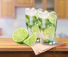 Tasty cold cocktail with ice and fresh lime slice