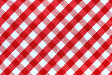 The texture of linen fabric in a large cell of red and white. Scottish tailoring material. checkered fabric - obrazy, fototapety, plakaty