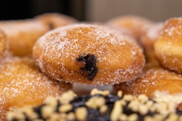 Stack of freshly-baked donuts arranged in neat rows on top of each other