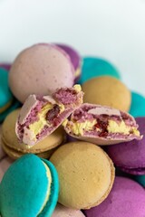 Delicious assortment of colorful macarons presented in a white bowl