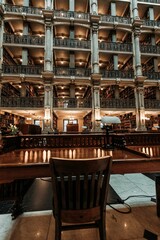 Interior view of a library featuring a bookshelf with rows of books