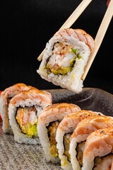 Close Up of Sushi Roll on Black Background