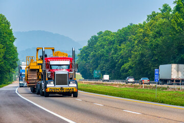 Heavy Machinery Being Transported On Tennessee Interstate Highway