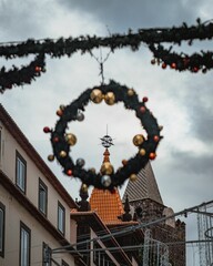 Fototapeta na wymiar Festive holiday decorations with buildings in the background