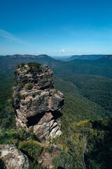 the view of the blue mountains from the edge of a cliff