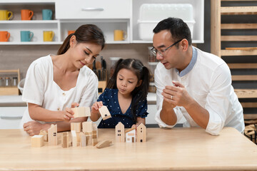 Happy kid girl play home toy with future plan concept and family at home	
