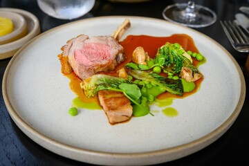 a plate with meat and vegetables is shown on a table