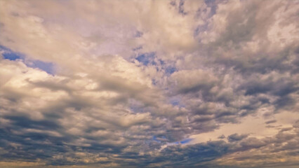 Fototapeta na wymiar cute sundown goldish clouds on the sky backdrop - photo of nature