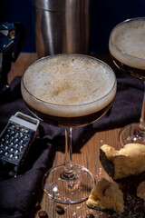 Parmesan Cheese Espresso Martini Cocktail, cheesy whipped coffee drink in martini glass with grated parmesan