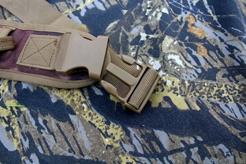 Traveler's and nature lover's accessories on camouflage material