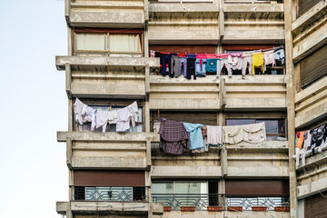 Residential building from the mid 20's century in the center of Rabat with clothes hanging in the balconies, Rabat, Morocco