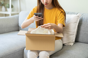 Complaint asian young woman hand using mobile phone take a photo product order from retail store...