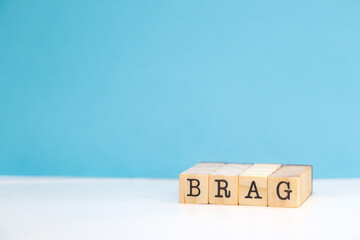 brag the word or concept represented on wooden cubes