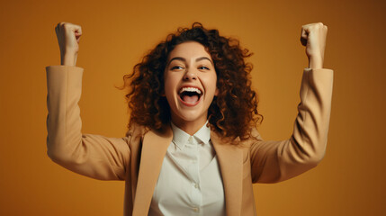 Joyful business woman freelancer entrepreneur smiling and rejoices in victory while sitting at desk and working at laptop after finishing project in home office - obrazy, fototapety, plakaty