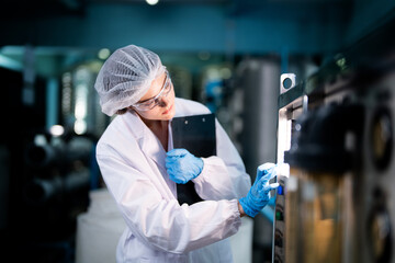 scientist worker checking the quality of Reverse osmosis machine system at the industrial factory....