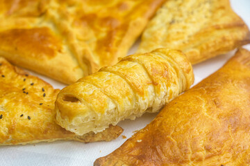 Appetizing pastries. Fast food. Snack from the bakery for a break. Background with selective focus