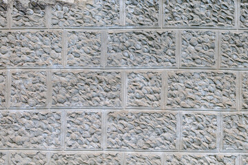 Plaster imitating natural stone. Rough textured wall surface. Background or backdrop. Blank for design