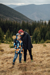 Two Brother boys stand at the top of the mountain. Ukrainian Carpathians