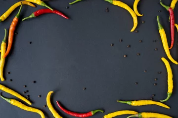 Fotobehang hot peppers of red and yellow color © viktoriya
