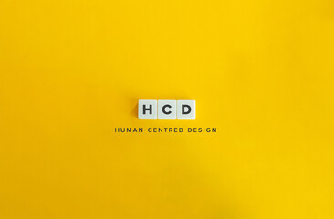 HCD Initialism for Human-Centred Design. Letter Tiles on Bright Orange Background.