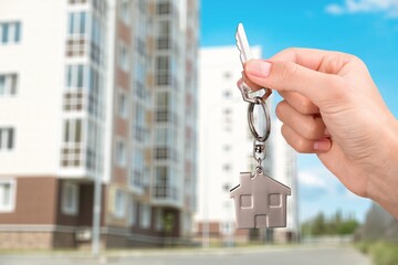 Real estate concept, agent hold home keys