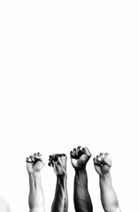 Four hands showing fists raised up, white background,  Created using generative AI tools.