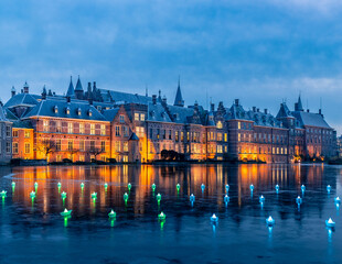 Fototapeta premium European Castle lit up at night. The Hague, Netherlands, during winter with a frozen pond.