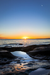 Sunrise over Tokyo Bay with the moon