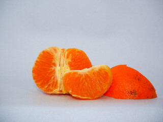 peeled tangerine on a wooden background