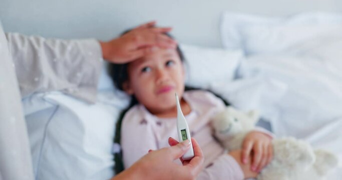 Thermometer, sick and parent help child or test flu on a bed in a bedroom at home for monitoring care and love. Hand, healthcare and kid or girl with illness or virus and mother with support