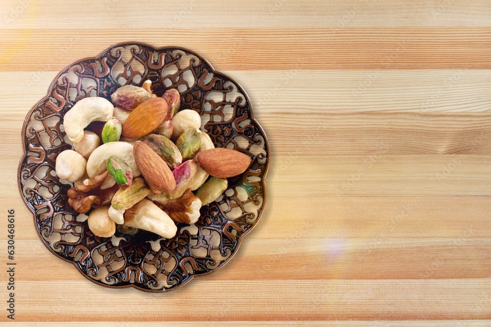 Canvas Prints mixed tasty nuts in bowl on the desk